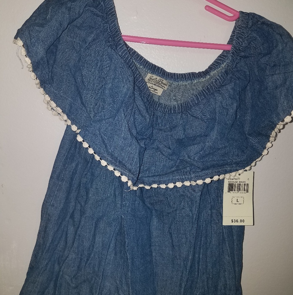 A denim cold shoulder top